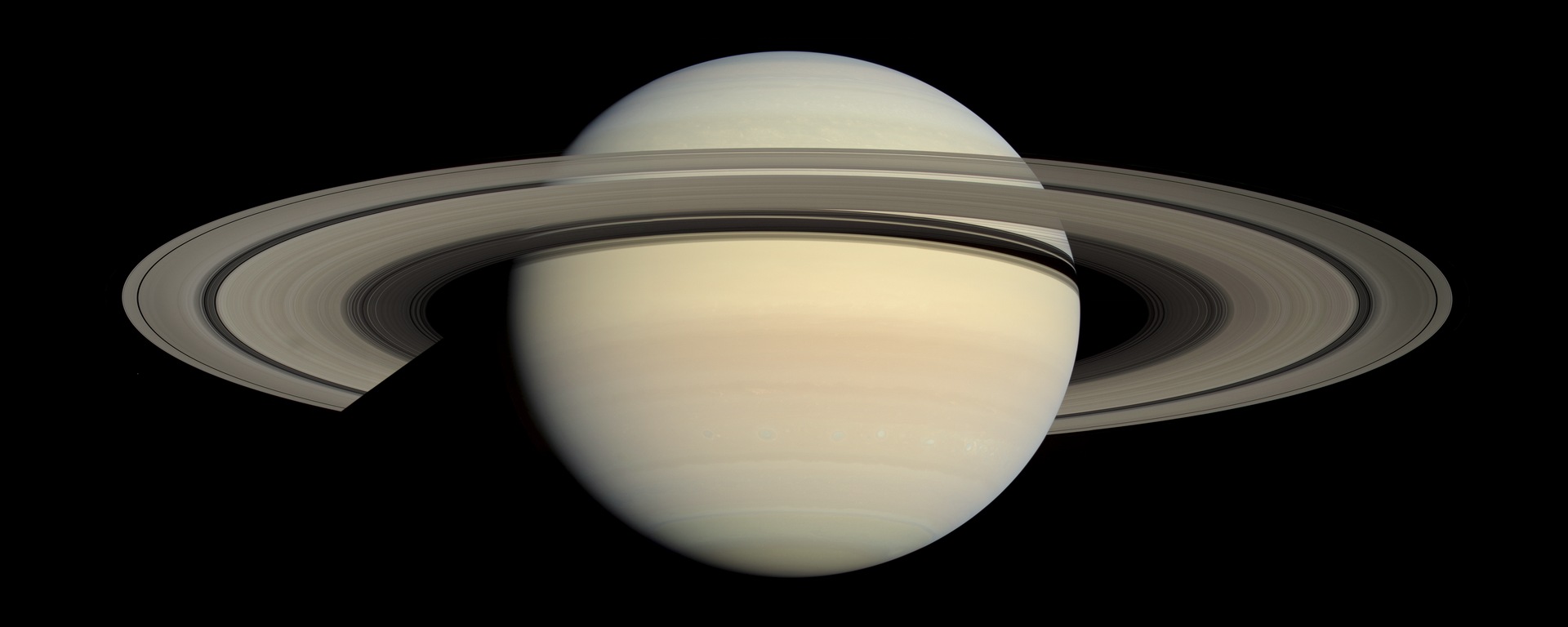 Rivers and Seas of Hydrocarbons. Related source image: Saturn global view from Cassini, rings open Better Colour